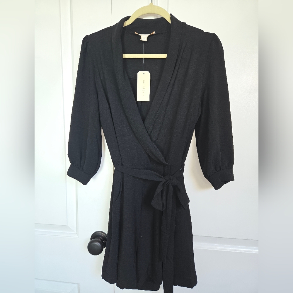 Belted shorts romper with belt and pockets. 3/4 sleeve. NWT